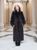 Black mink full-length fur coat with high collar and button front, long sleeves