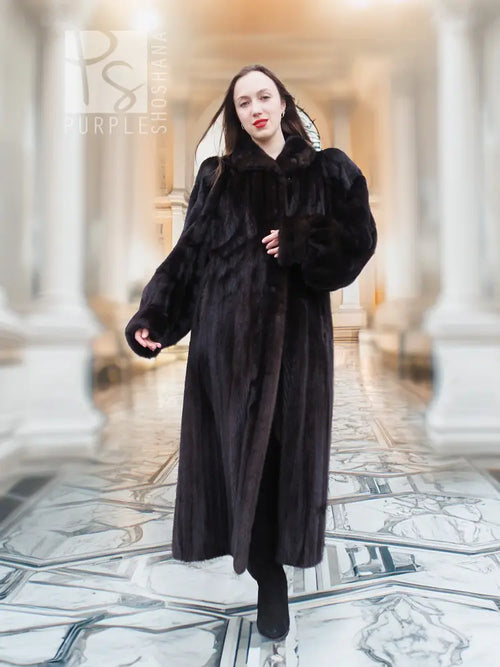 Black mink full-length fur coat with high collar and long sleeves, standing front view