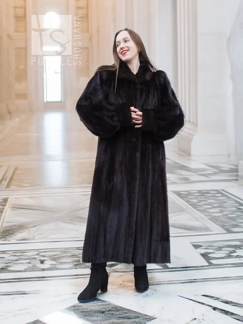 Black mink full-length fur coat with high collar and long sleeves, standing front view