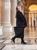 Black mink fur coat, side view with long sleeves and full-length silhouette