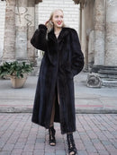 Black mink fur coat with wide fur collar and side stance, full-length.