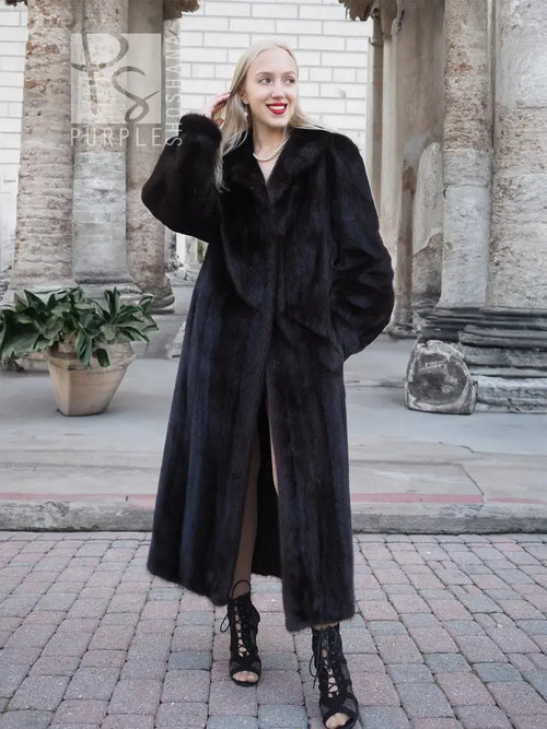 Black mink fur coat with wide fur collar and side stance, full-length.