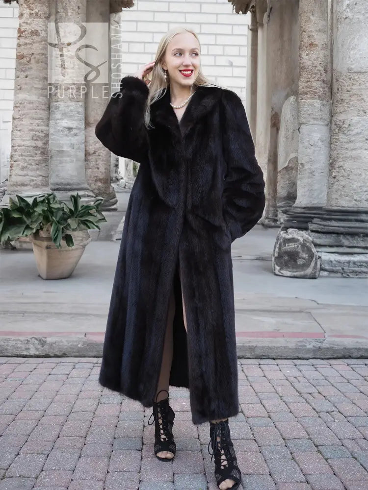 Black mink fur coat with wide fur collar and side stance, full-length.