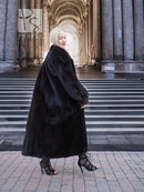 Black mink fur coat with full skirt silhouette and plush fur texture