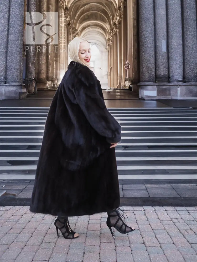 Black mink fur coat with full skirt silhouette and plush fur texture