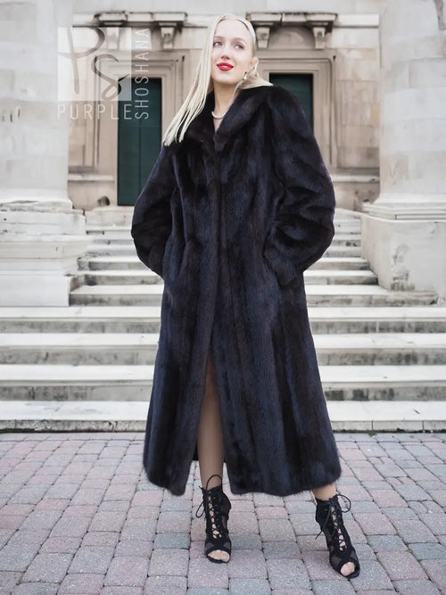 Black mink fur coat with open front and long fur sleeves, midi-to-floor length.