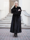 Black mink fur coat with wrap-style V front, long sleeves, full-length hem.