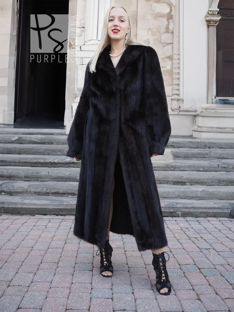 Black mink fur coat with hood, long length and relaxed fit, front view.