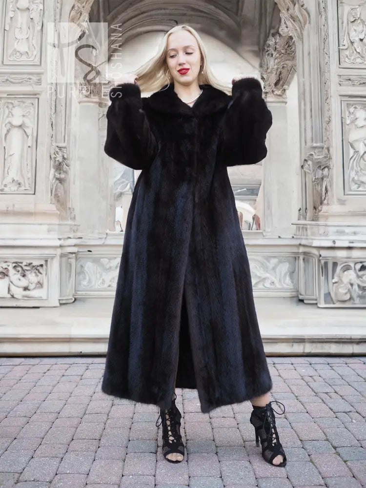 Black mink fur coat with V neckline and long sleeves, full-length dark fur.