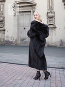 Black mink fur coat, long hooded coat with plush fur cuffs and front closure.