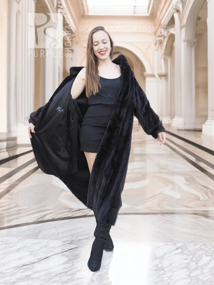 Black mink fur coat with relaxed drape and flared hem