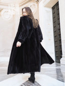 Black mink fur coat with flared skirt and long, rounded sleeves