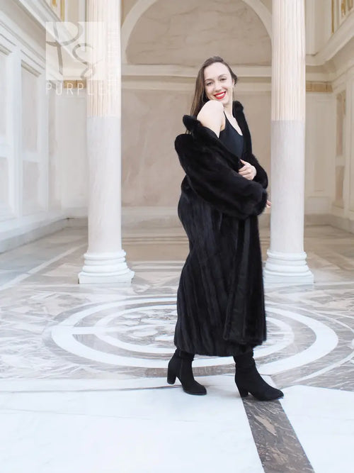 Black mink fur coat with long sleeves and straight, slim silhouette