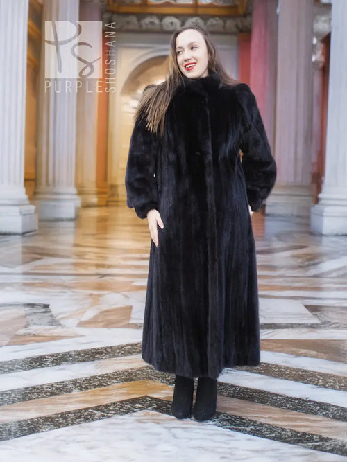 Black mink fur coat, three-quarter angle front view with long rounded sleeves.