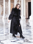 Black mink fur coat with A-line silhouette, long sleeves, high collar and button front