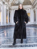 Black mink fur coat, full length with high neck and long sleeves, front view.