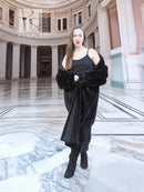 Black mink fur coat with front button closure and long, fitted sleeves