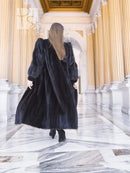Black mink fur coat with long sleeves and full, flared skirt hem
