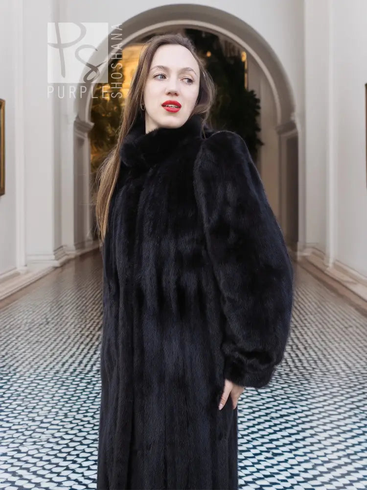 Black mink fur coat, near head-and-shoulders view with high neck and dense fur.
