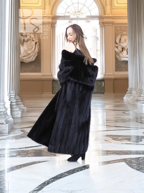 Black mink fur coat with mid-calf length and soft, dense fur texture