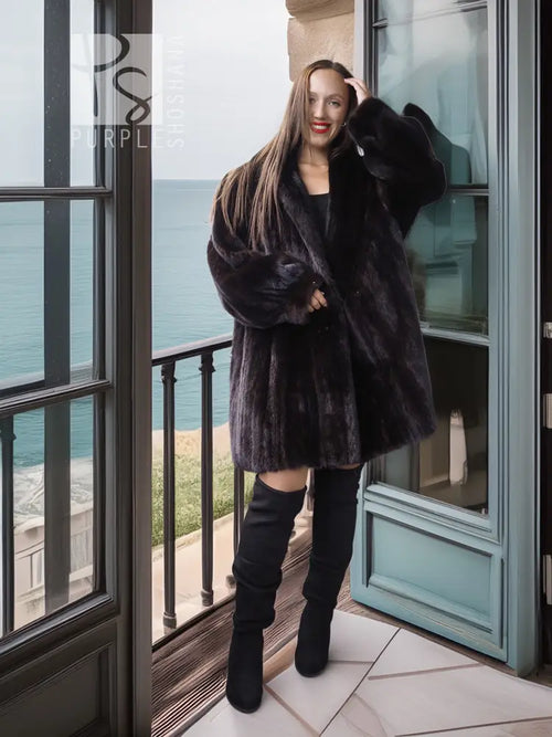 Black mink coat jacket with a wide neckline and full sleeves, plush fur texture