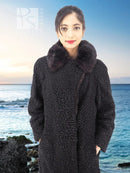 Black curly lamb coat with mink fur collar, front view close-up of textured fabric
