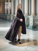 Black mink coat with dramatic sweeping back and thigh-high front split