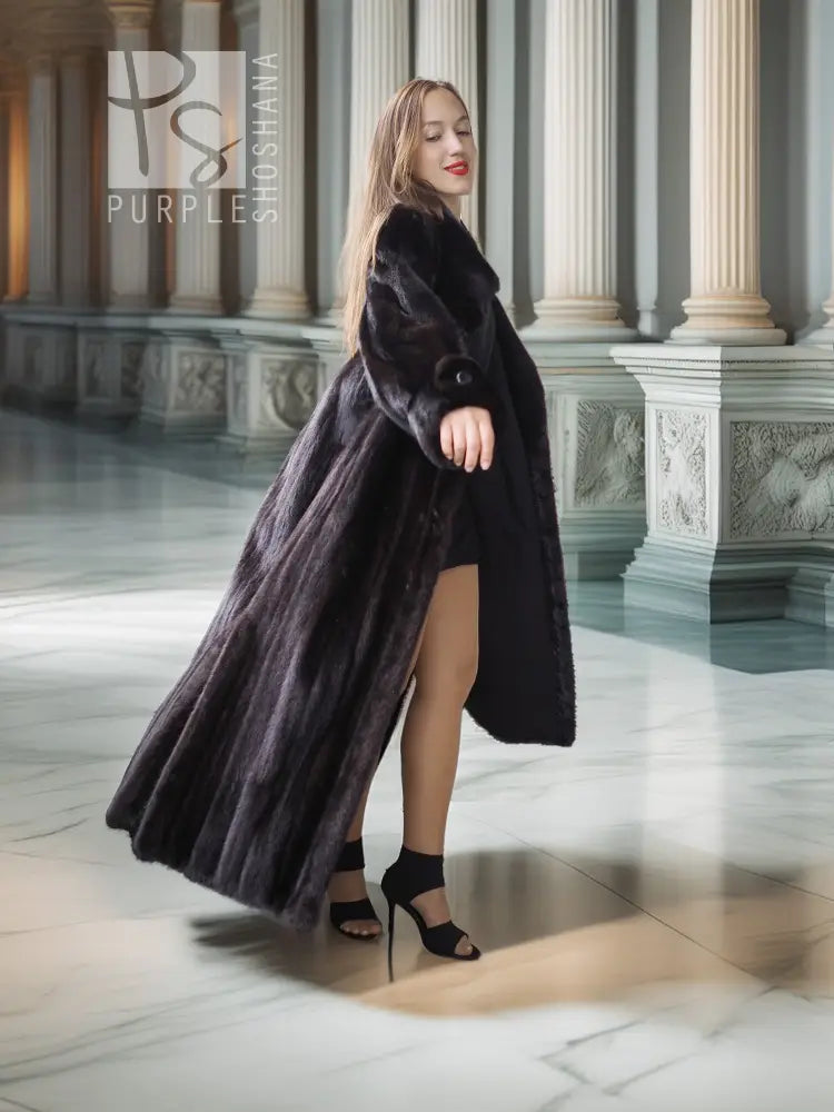 Black mink coat with dramatic sweeping back and thigh-high front split