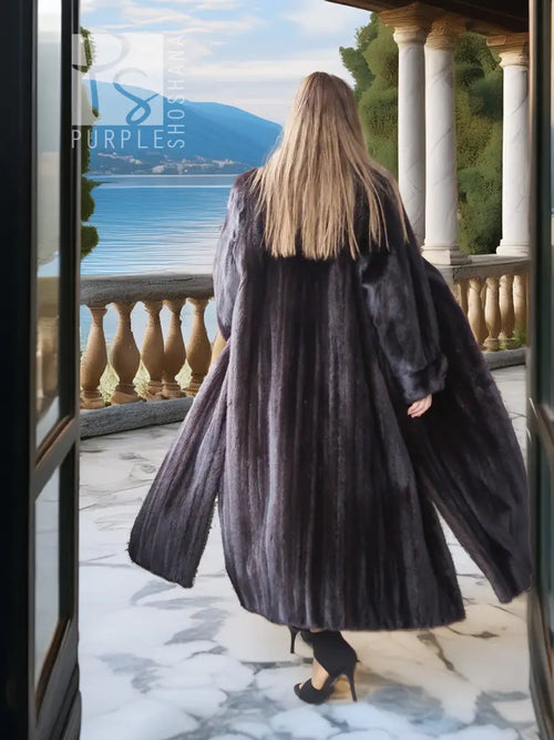Black mink coat with sculpted collar and dramatic flared sweep back
