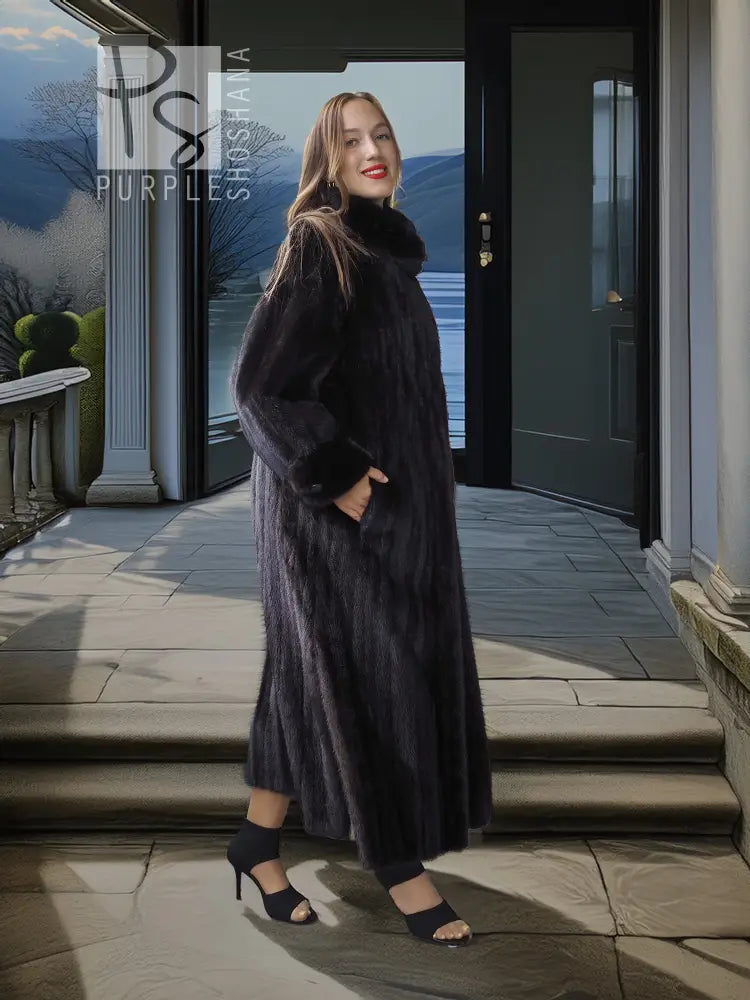 Black mink coat with sculpted collar and dramatic sweeping silhouette