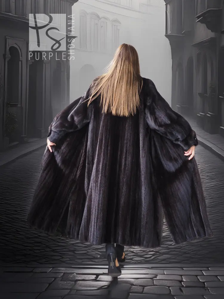 Black mink coat back view, dramatic sweep and wide sleeves, long A-line hem