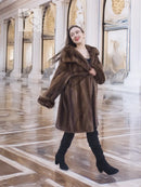 Brown mink fur coat with off-shoulder fur collar and a voluminous swing silhouette.