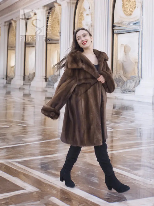 Brown mink fur coat with off-shoulder fur collar and a voluminous swing silhouette.