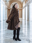 Women’s hooded mink fur swing coat in dark brown, wide collar, side view, long sleeves