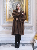 Women’s hooded mink fur swing coat in dark brown, full-length front view, long sleeves