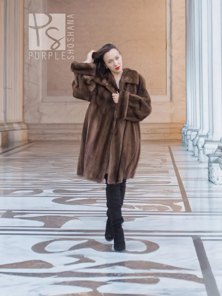 Women’s hooded mink fur swing coat in dark brown, front button closure, long sleeves