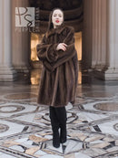 Dark brown fur swing coat with hood and long sleeves, front view.