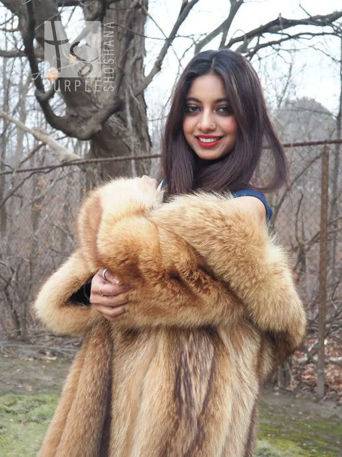 Tanuki raccoon fur coat, tan, cropped front view with plush collar and sleeves