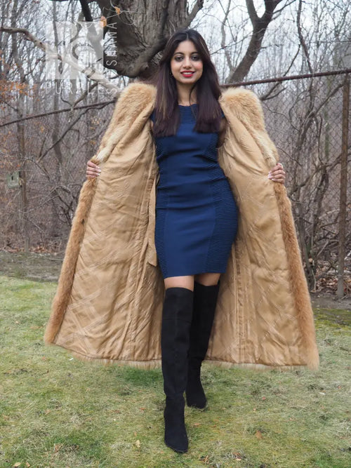 Tanuki raccoon fur coat with hood and open front, tan fur, full-body view with hands at sides.