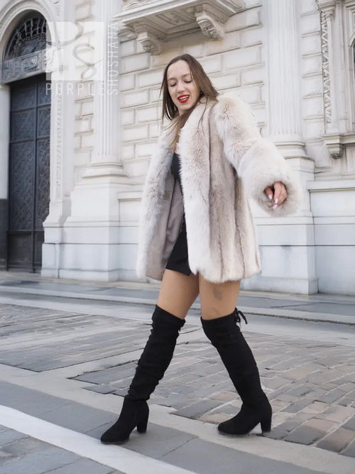 Short fur coat jacket with plush texture and structured collar, mid-thigh length