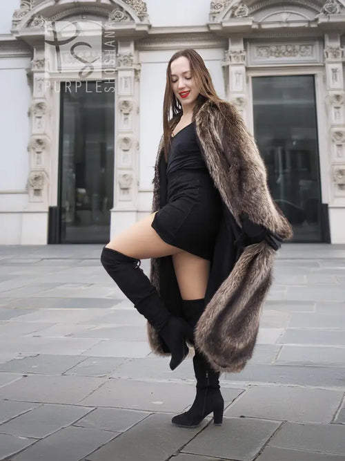 Raccoon fur coat with scalloped hem, draped shoulders, side pose