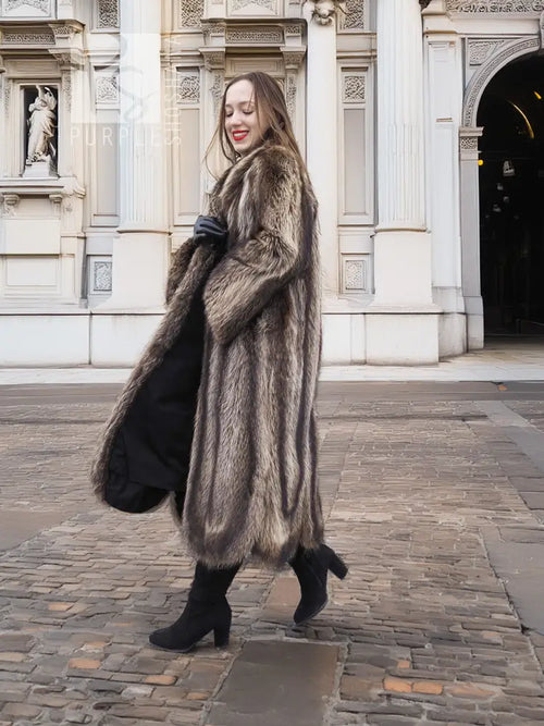 Dark brown fur coat with long sleeves, scalloped hem, and button-front closure