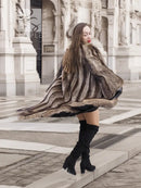 Dark brown fur coat with scalloped hem and long sleeves, flowing fringe detail