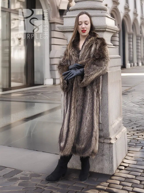Raccoon fur coat in dark brown with open front and thick collar, arms folded