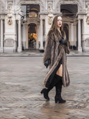 Long raccoon fur coat with scalloped hem, open front with slit detail