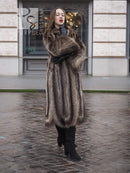 Full-length dark brown raccoon fur coat with open front and long sleeves, standing