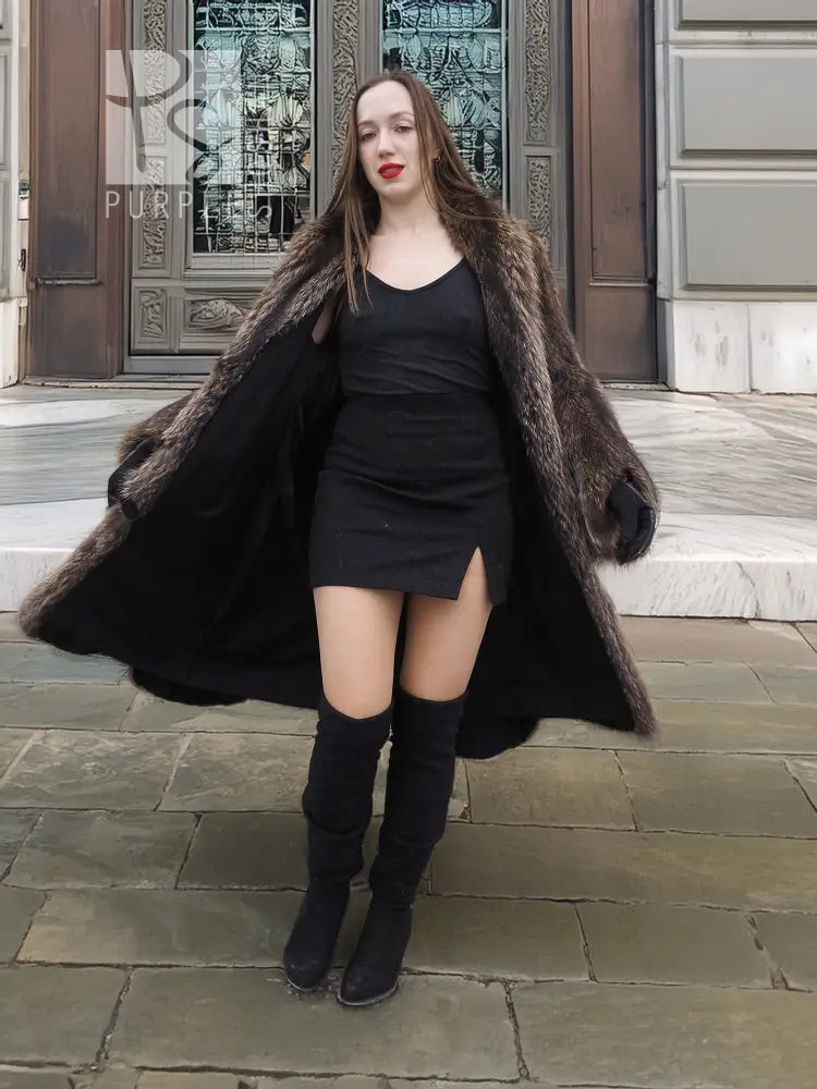 Raccoon fur coat with scalloped hem, open front over black mini dress, standing pose