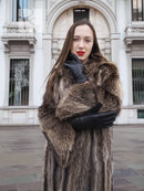Dark brown raccoon fur coat with fur collar and black gloves, front close-up