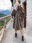 Dark fur hooded coat with structured shoulders and flared mid-calf length