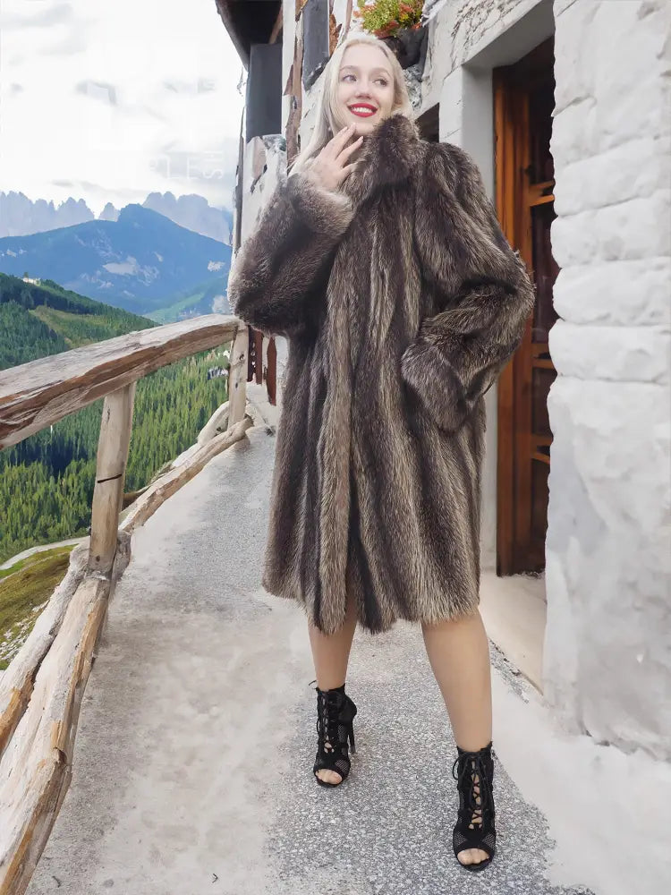 Dark fur hooded coat with structured shoulders and flared mid-calf length